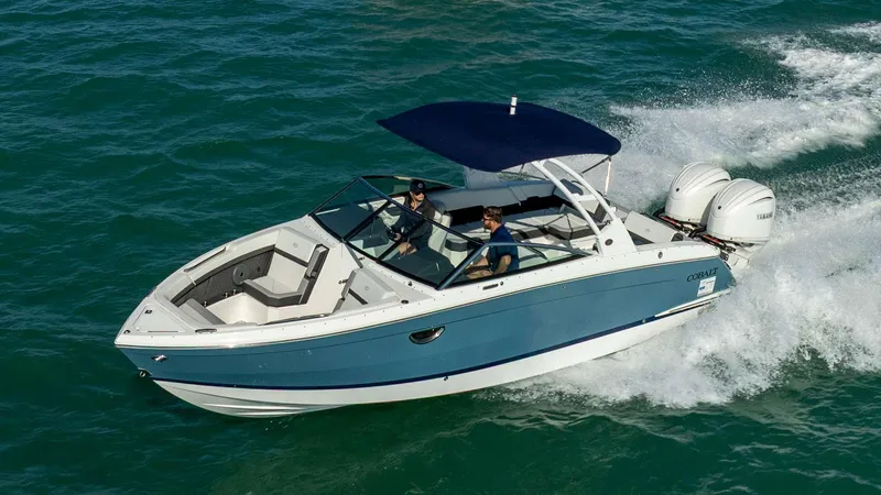 Slide: The Image of 2023 Cobalt R8 boat cruising on open water with dual engines. - 1