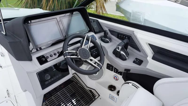 Slide: The Image of 2023 Cobalt R8 boat dashboard with dual screens and modern controls. - 10