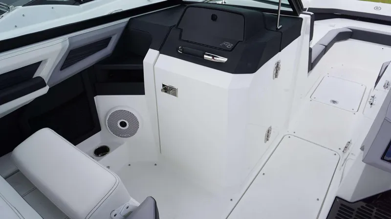 Slide: The Image of 2023 Cobalt R8 boat interior with sleek white seating and modern dashboard design. - 11
