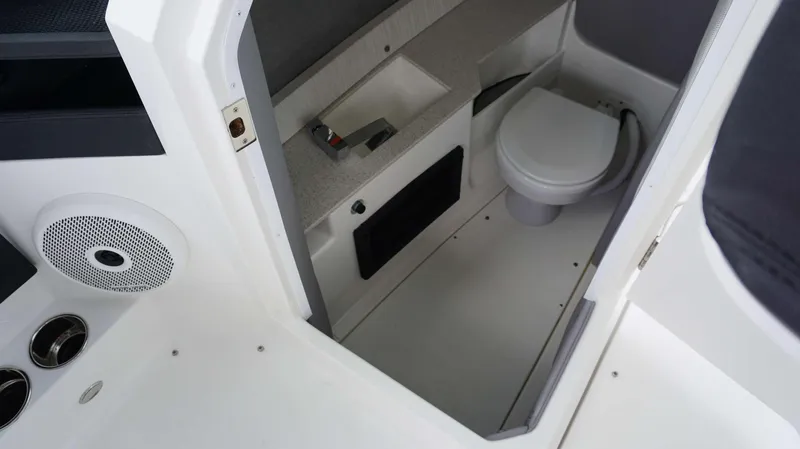 Slide: The Image of 2023 Cobalt R8 boat interior with compact bathroom and modern amenities. - 15