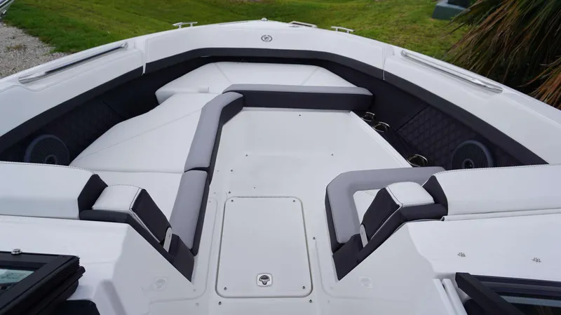 Slide: The Image of 2023 Cobalt R8 boat interior with sleek white and gray seating. - 24
