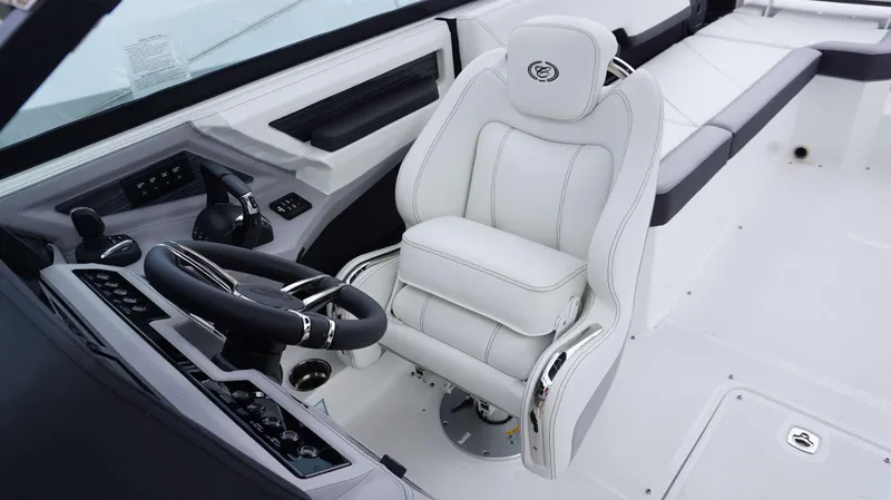 Slide: The Image of Luxurious interior of 2023 Cobalt R8 boat with white captain's chair and modern controls. - 28
