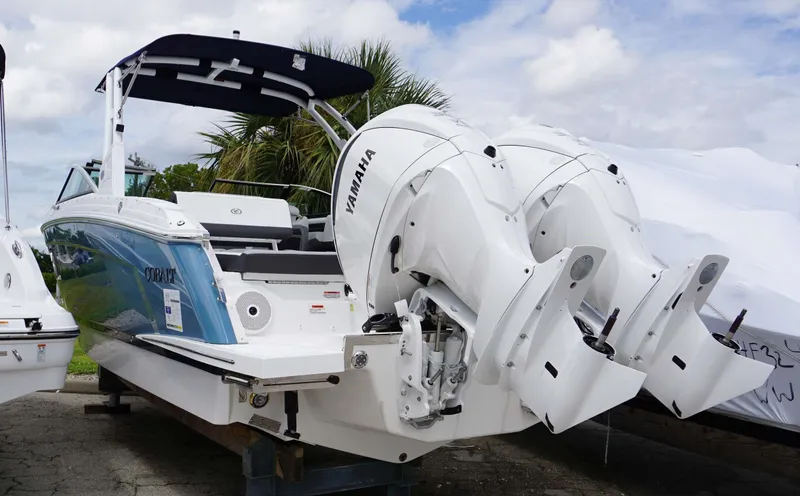 Slide: The Image of 2023 Cobalt R8 boat with dual Yamaha outboard engines, docked outdoors. - 5