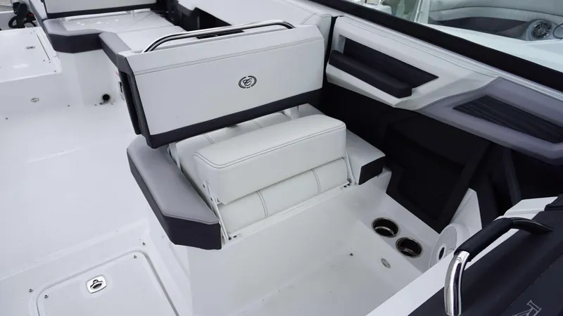 Slide: The Image of 2023 Cobalt R8 boat interior with sleek white seating and cup holders. - 6