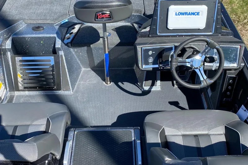 Slide: The Image of 2023 Ranger Z521R boat interior with Lowrance electronics and seating. - 2