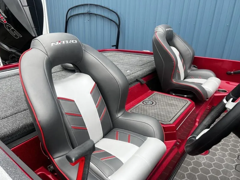 Slide: The Image of 2023 Nitro Z21 XL Pro boat interior with gray and red seats. - 5