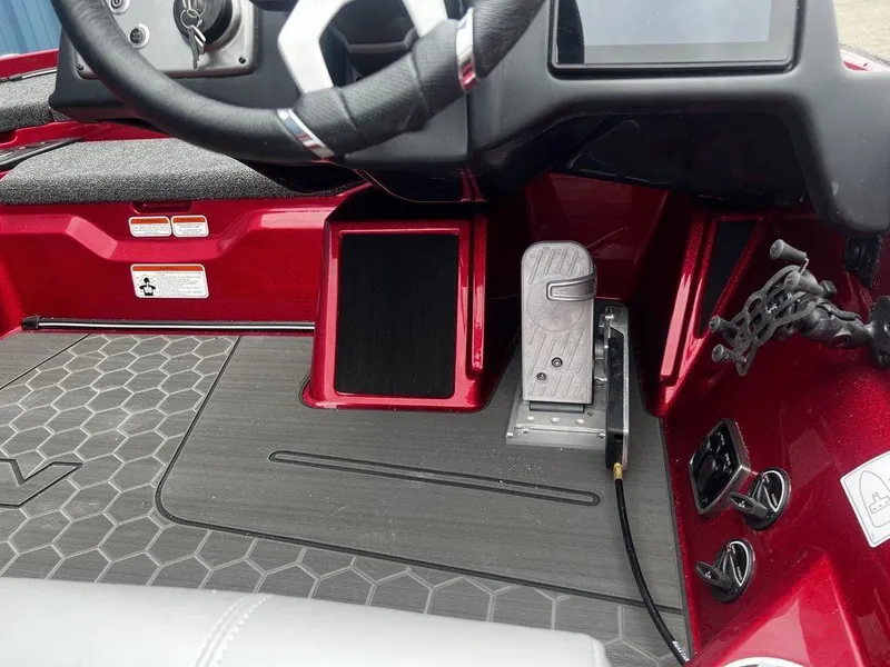 Slide: The Image of 2023 Nitro Z21 XL Pro boat cockpit with steering wheel and foot pedal. - 7