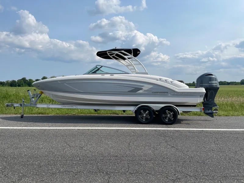 The Image of 2024 Chaparral 23 SSi OB boat on a trailer, side view. - 0