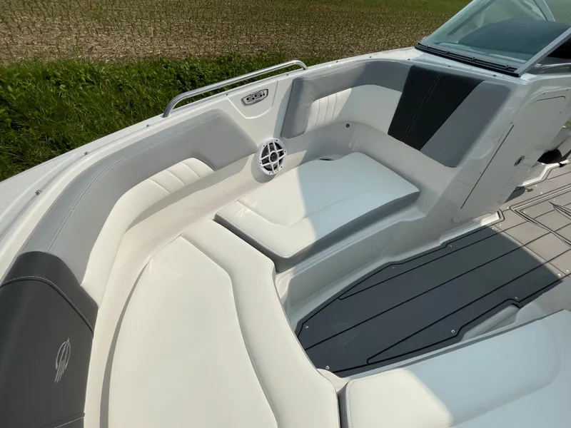 Slide: The Image of 2024 Chaparral 23 SSi OB boat interior with white and gray seating. - 15