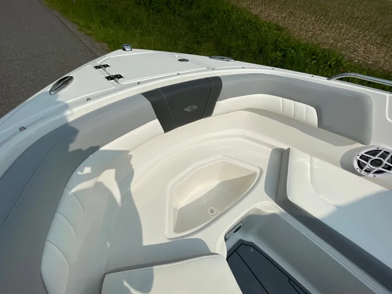 Slide: The Image of 2024 Chaparral 23 SSi OB boat interior, featuring spacious seating and storage compartments. - 18