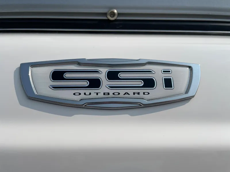 Slide: The Image of 2024 Chaparral 23 SSi OB outboard emblem on white background. - 2