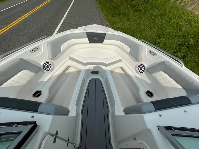 Slide: The Image of 2024 Chaparral 23 SSi OB boat interior with spacious seating and modern design. - 20