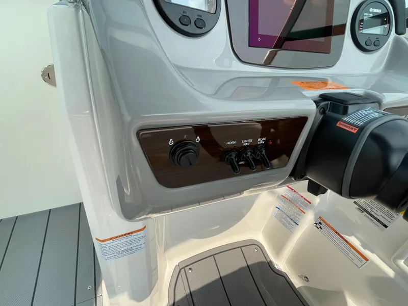 Slide: The Image of Control panel of 2024 Chaparral 23 SSi OB boat with modern dashboard. - 28