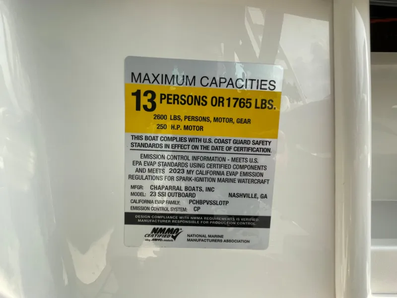 Slide: The Image of 2024 Chaparral 23 SSi OB boat capacity label, 13 persons or 1765 lbs. - 30
