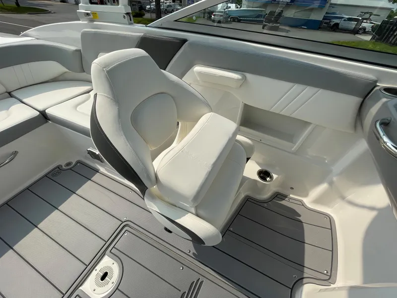 Slide: The Image of 2024 Chaparral 23 SSi OB boat interior with white and gray seating. - 38