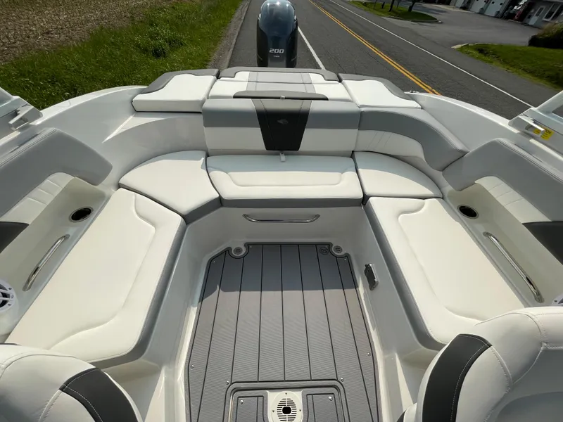 Slide: The Image of 2024 Chaparral 23 SSi OB boat interior with spacious seating and modern design. - 43