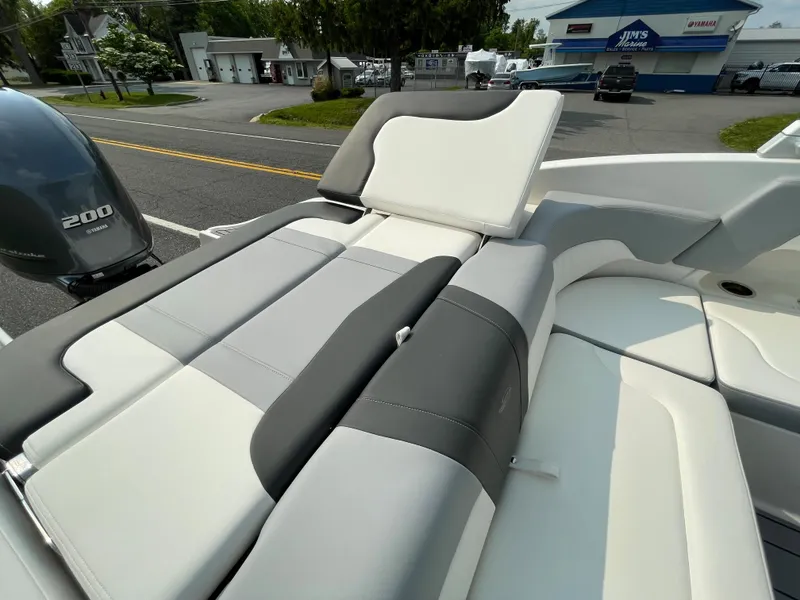 Slide: The Image of 2024 Chaparral 23 SSi OB boat with comfortable seating and 200 HP outboard motor. - 49