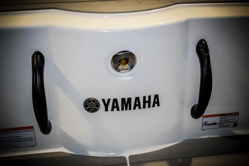 Slide: The Image of 2023 Yamaha Boats AR220 rear view with logo and handles. - 11