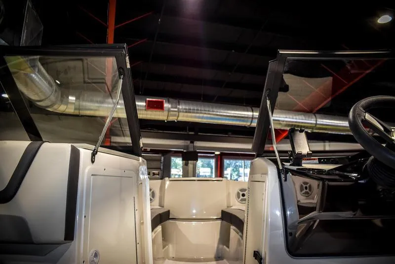 Slide: The Image of 2023 Yamaha Boats AR220 interior view with open windshield. - 29