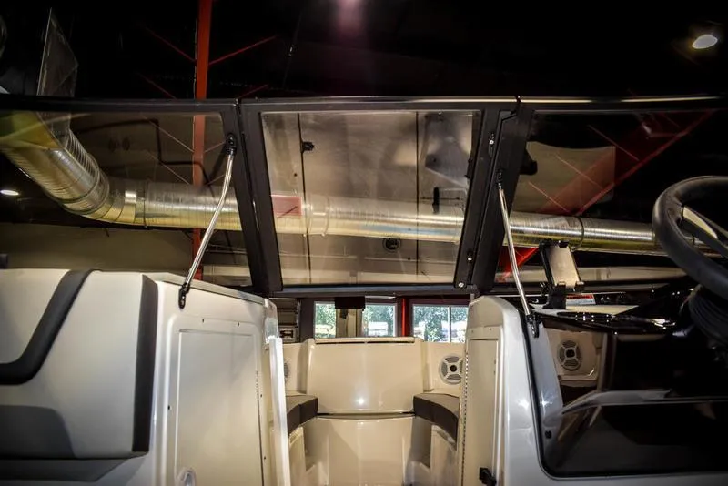 Slide: The Image of 2023 Yamaha Boats AR220 interior view with open windshield. - 30