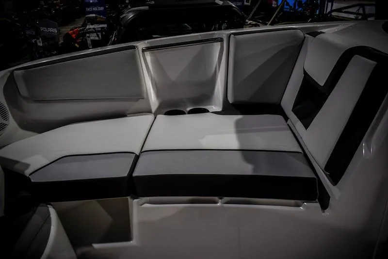 Slide: The Image of 2023 Yamaha Boats AR220 interior seating with modern design and comfortable cushions. - 37