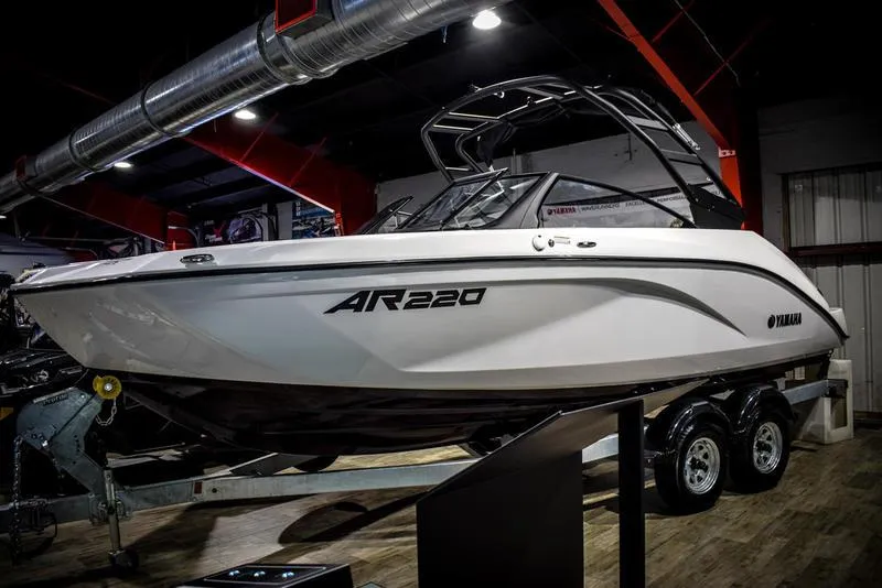 Slide: The Image of 2023 Yamaha Boats AR220 on display in a showroom. - 4