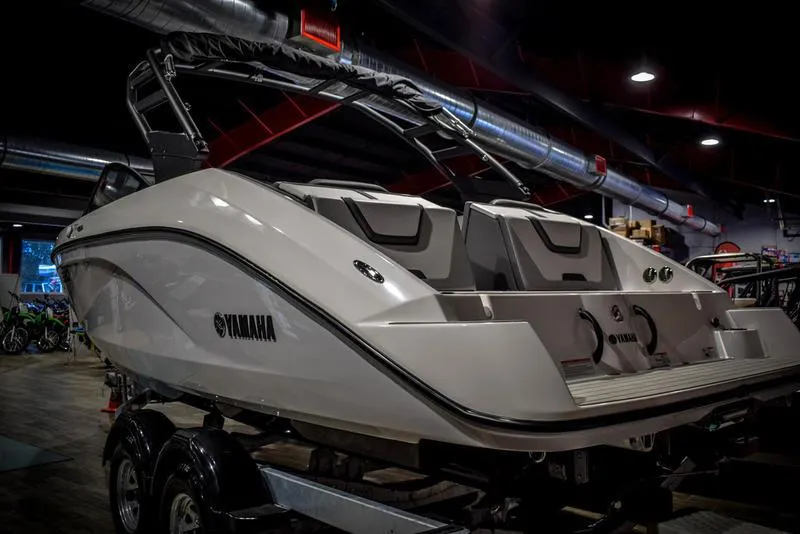 Slide: The Image of 2023 Yamaha Boats AR220 in showroom, rear view. - 5