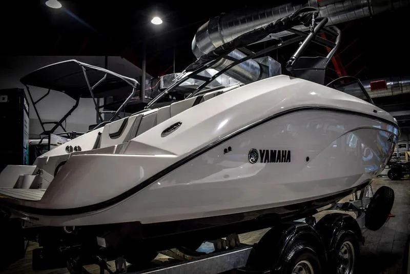 Slide: The Image of 2023 Yamaha Boats AR220 on trailer in showroom. - 6