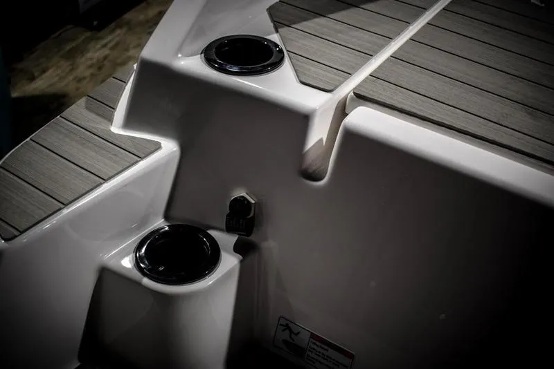 Slide: The Image of 2023 Yamaha Boats AR220 deck with cup holders and sleek design. - 9