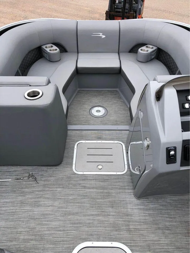 Slide: The Image of 2022 Bennington 24 RTSB boat interior with gray seating and modern design. - 5