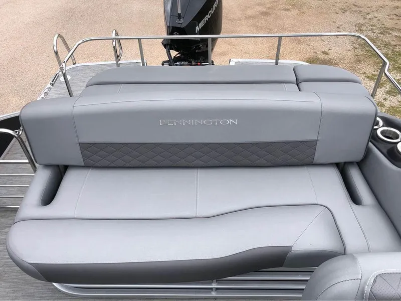 Slide: The Image of 2022 Bennington 24 RTSB boat with gray seating and diamond-patterned upholstery. - 6