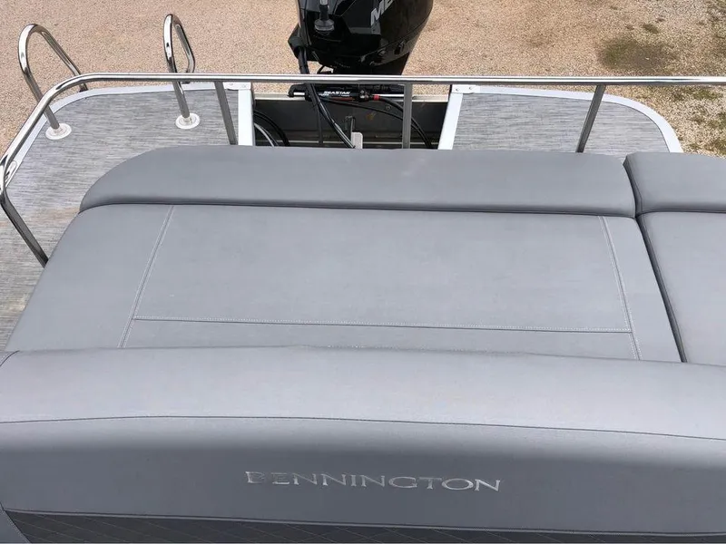 Slide: The Image of 2022 Bennington 24 RTSB boat with gray seating and rear motor view. - 7