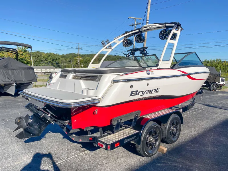 Slide: The Image of 2018 Bryant Speranza boat on trailer, red and white, rear view. - 1