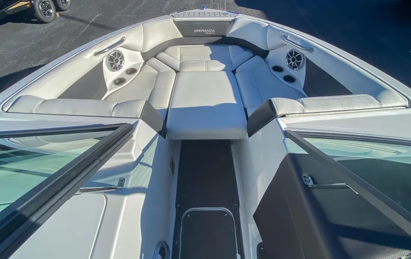 Slide: The Image of 2018 Bryant Speranza boat interior with cushioned seating and built-in speakers. - 10