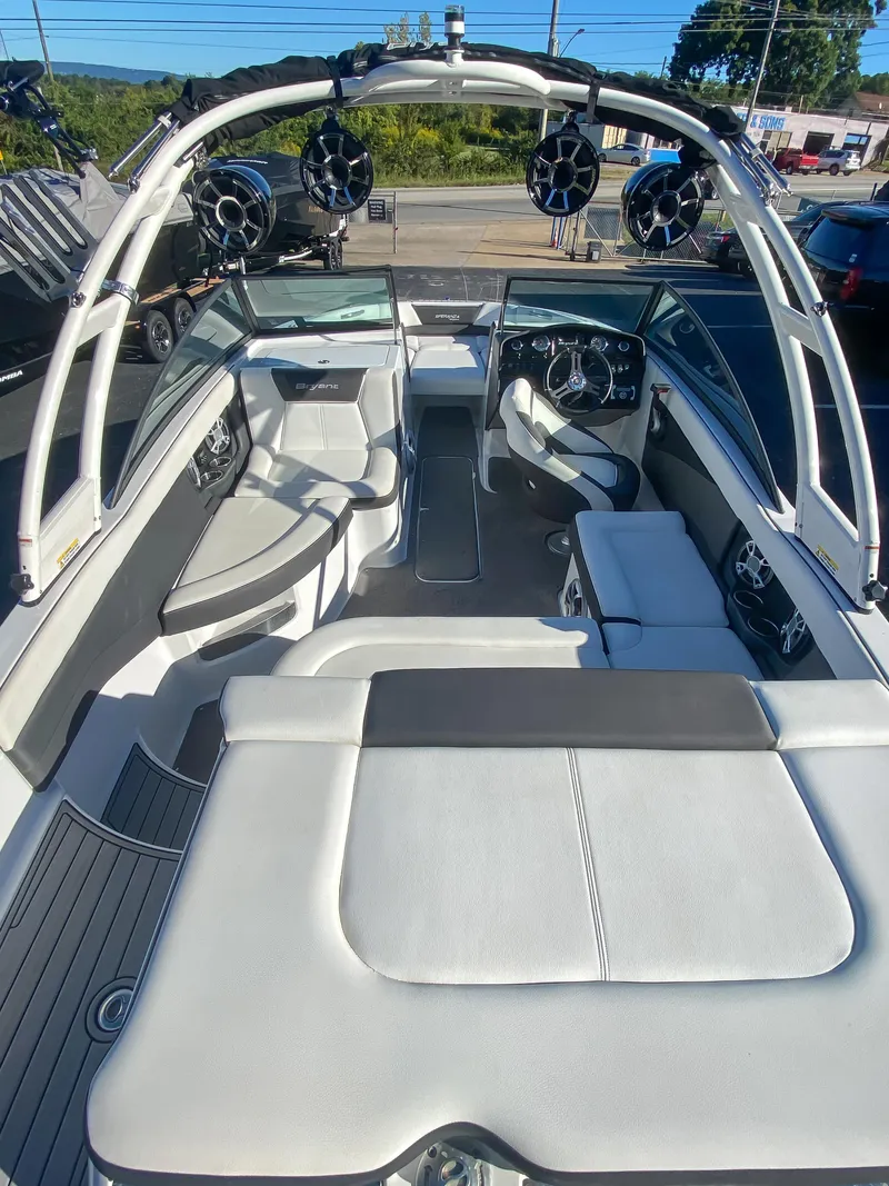 Slide: The Image of 2018 Bryant Speranza boat interior with white seating and modern dashboard. - 11
