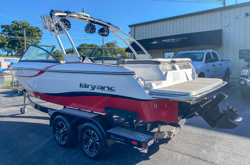 Slide: The Image of 2018 Bryant Speranza boat on a trailer outside a dealership. - 2