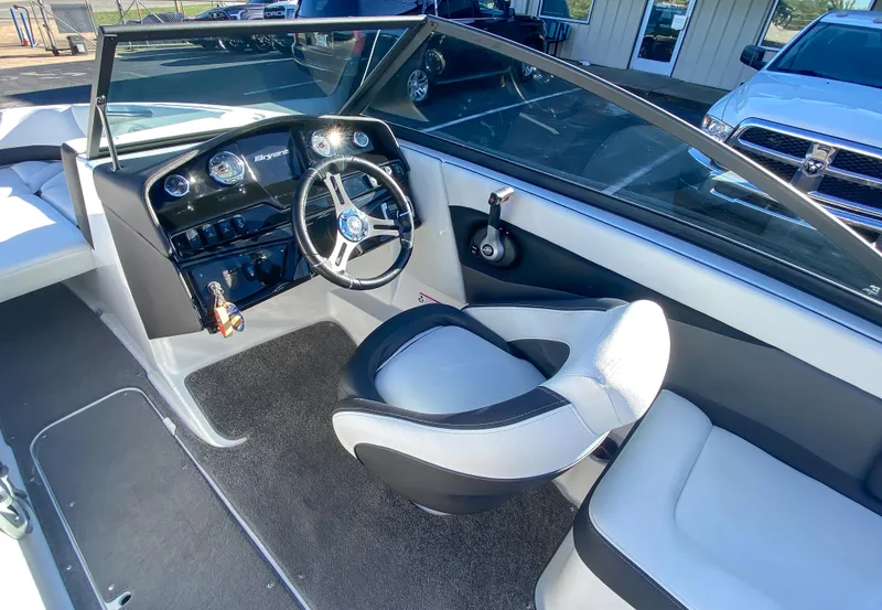 Slide: The Image of 2018 Bryant Speranza boat interior with steering wheel and seating. - 6