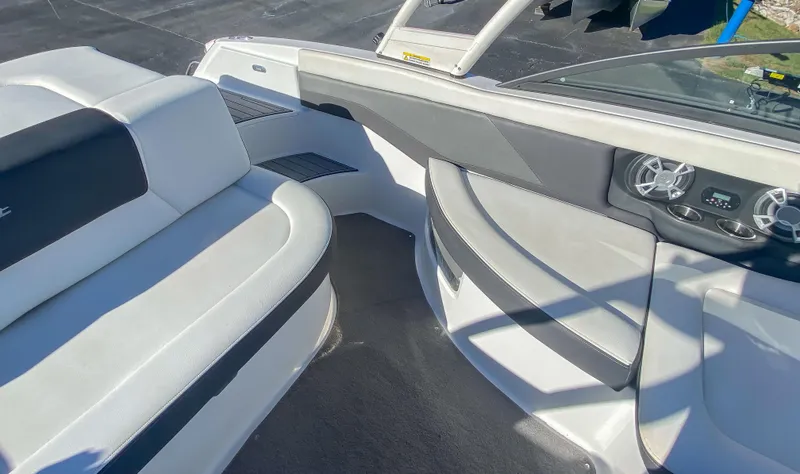 Slide: The Image of 2018 Bryant Speranza boat interior with white and gray seating and dashboard. - 7