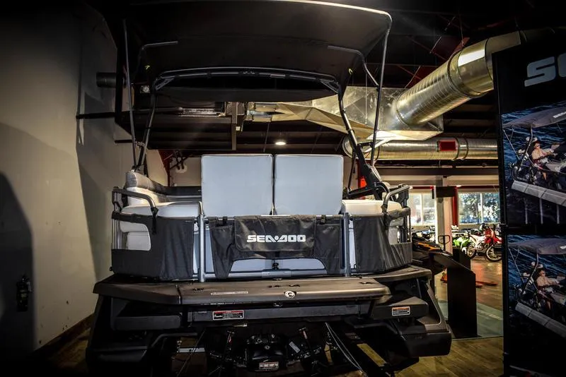 Slide: The Image of 2022 Sea-Doo Switch Sport 21 in showroom, rear view. - 4