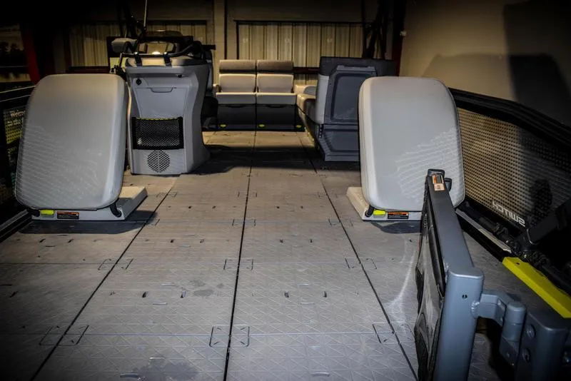 Slide: The Image of Interior of a 2022 Sea-Doo Switch Sport 21 pontoon boat with spacious seating. - 5