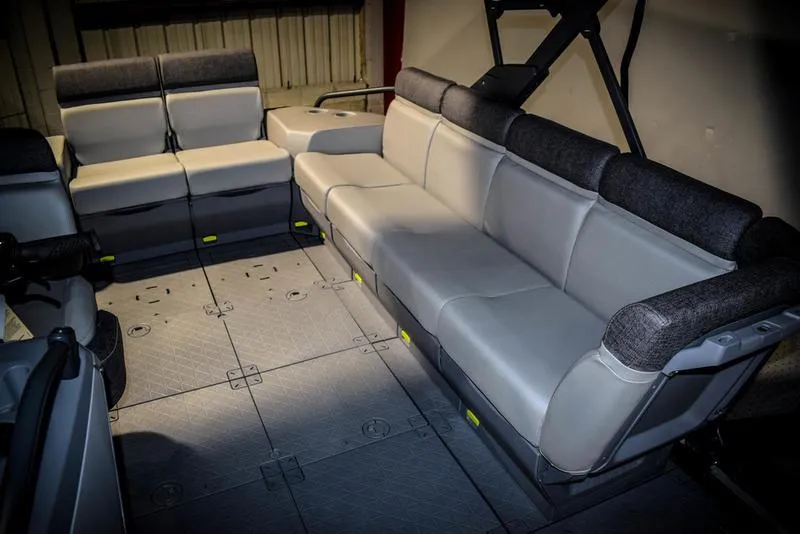 Slide: The Image of 2022 Sea-Doo Switch Sport 21 interior seating area with gray and black upholstery. - 6
