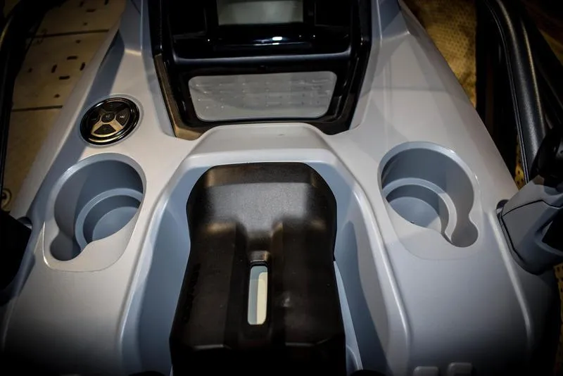 Slide: The Image of 2023 Sea-Doo Switch Sport 21 console with cup holders and control panel. - 13