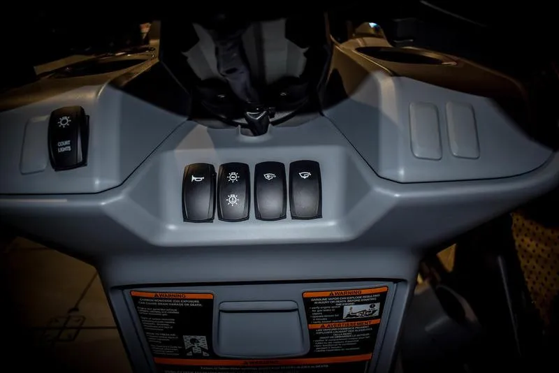 Slide: The Image of Control panel of 2023 Sea-Doo Switch Sport 21 with various switches. - 15