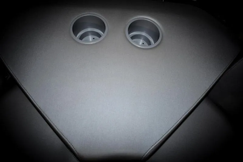 Slide: The Image of 2023 Sea-Doo Switch Sport 21 boat interior with dual cup holders. - 17