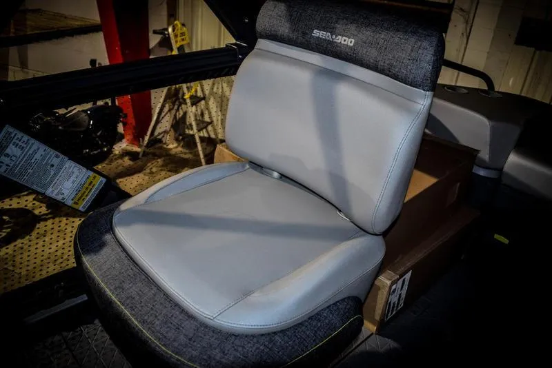 Slide: The Image of 2023 Sea-Doo Switch Sport 21 seat, gray and black upholstery, close-up view. - 18
