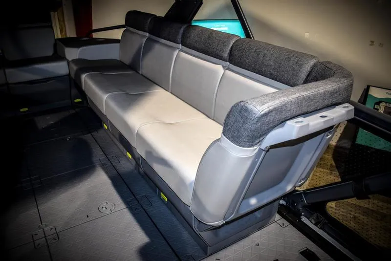 Slide: The Image of 2023 Sea-Doo Switch Sport 21 interior seating with gray and black upholstery. - 9