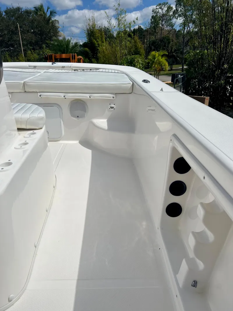 Slide: The Image of 2010 Carolina Skiff 198 DLV Elite boat interior with seating and storage compartments. - 13