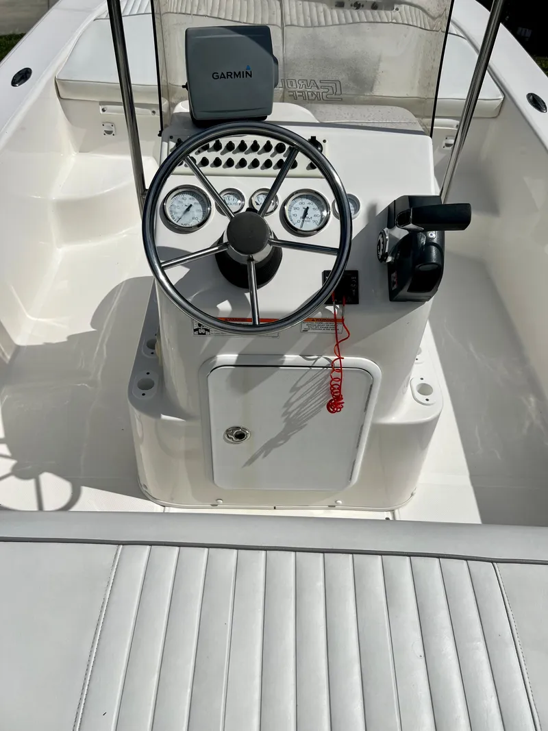 Slide: The Image of 2010 Carolina Skiff 198 DLV Elite boat console with Garmin GPS and steering wheel. - 17