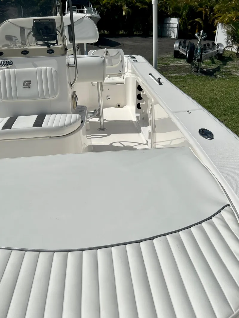 Slide: The Image of 2010 Carolina Skiff 198 DLV Elite boat interior with white seating and console. - 21