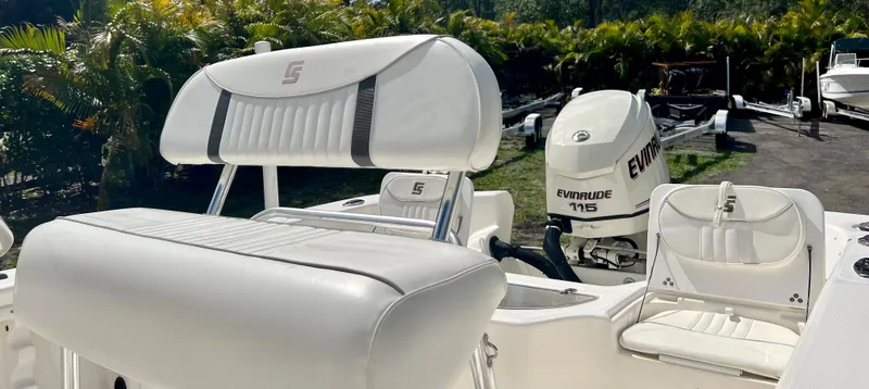 Slide: The Image of 2010 Carolina Skiff 198 DLV Elite boat with Evinrude 115 engine, white seating. - 23